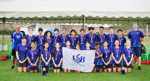 Members of the ISB U13 FOBISIA Team pose together after an outstanding performance at the 2025 FOBISIA Games. The team won an impressive 79 medals in total, with every student earning at least one medal.
