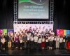 ISB students awarded Gold, Silver, and Bronze Duke of Edinburgh International Awards pose with Dr. Peter Jones, Head of ISB Secondary, along with teachers and staff, during the DofE International Award Ceremony at the ISB Theatre on April 15, 2025.